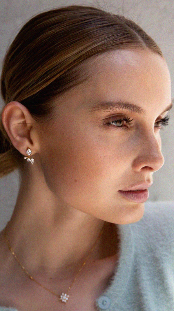 Gold Vermeil ear jackets featuring a pear-cut stud and curved under-lobe drop