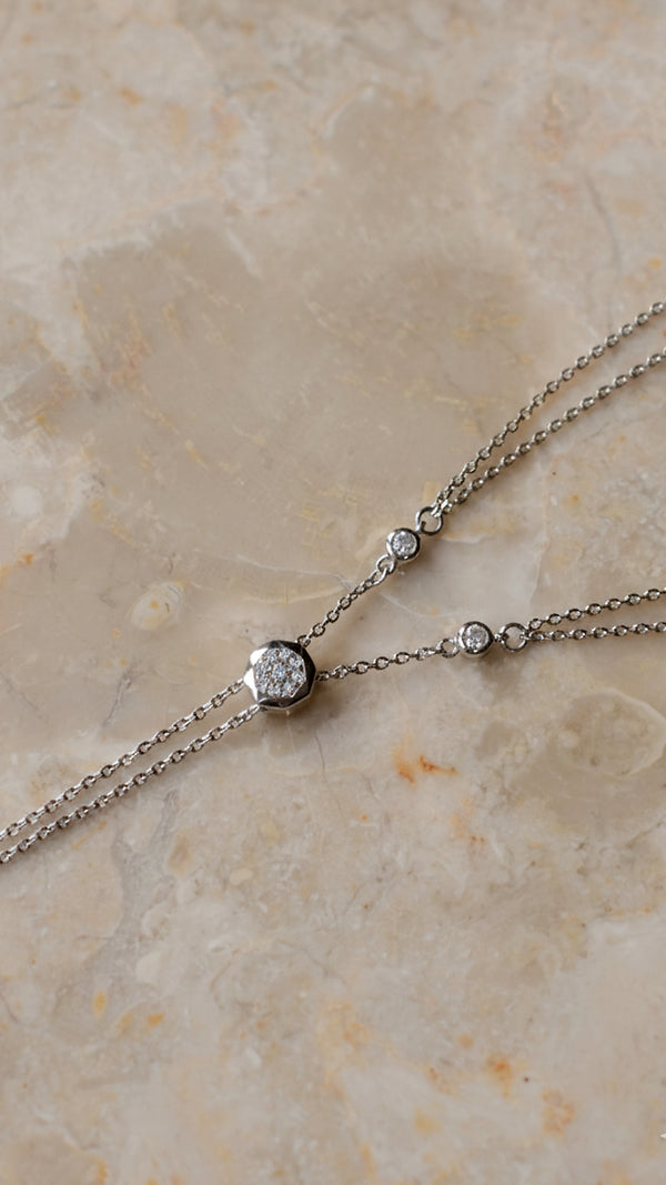 Sterling silver layered necklace set with an ajustable slider.