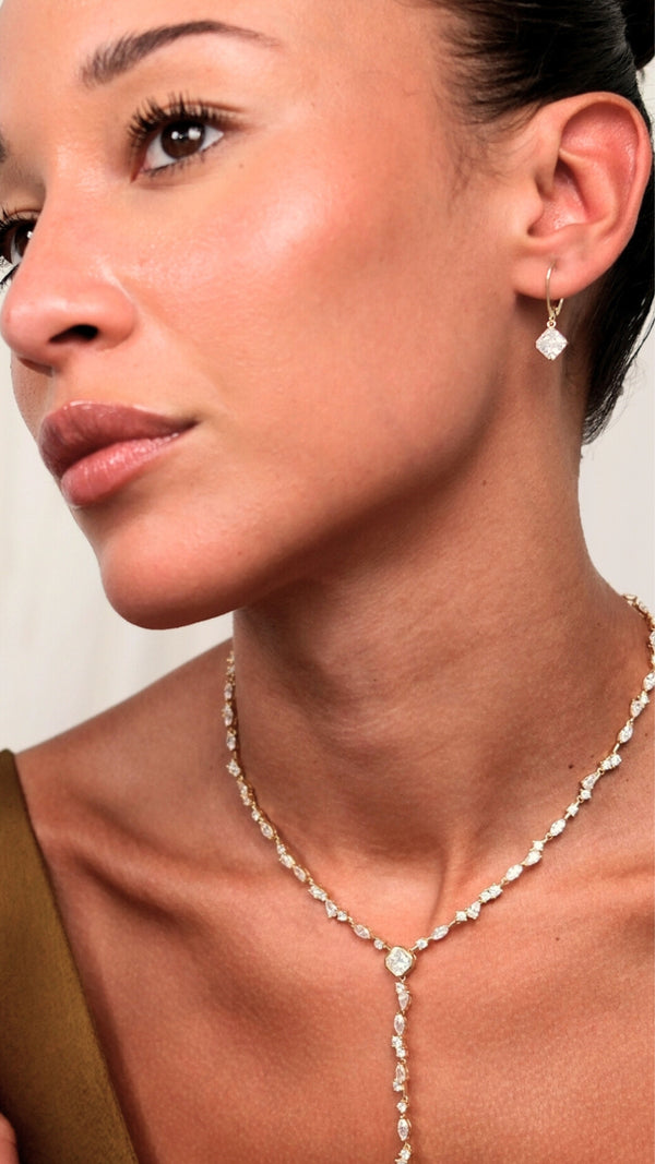 Safe and secure princess cut solitaire hoop drop earrings with lever clasp mechanism.