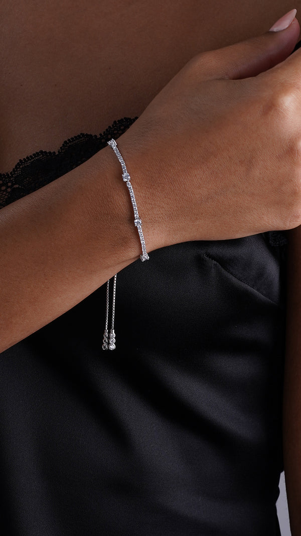 Elegant adjustable tennis bracelet with a diamond-style design in white gold for women.