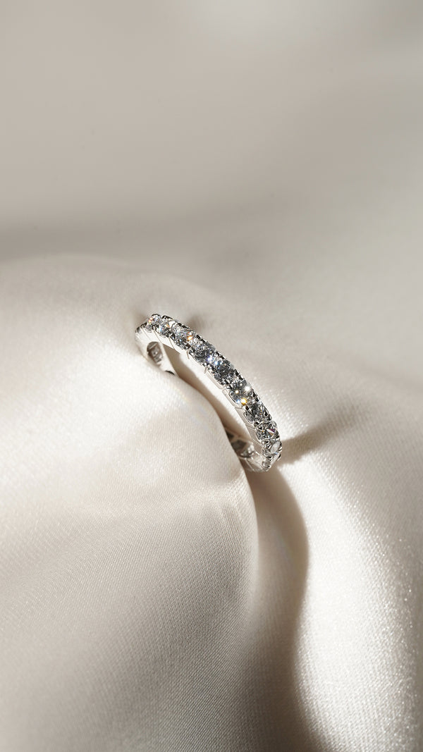 Solid white gold eternity ring with sparkling round gemstones