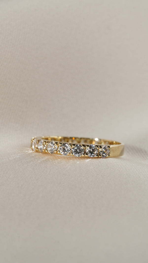 Front on view of the Raina eternity bands row of exquisitely cut and polished round stones 
