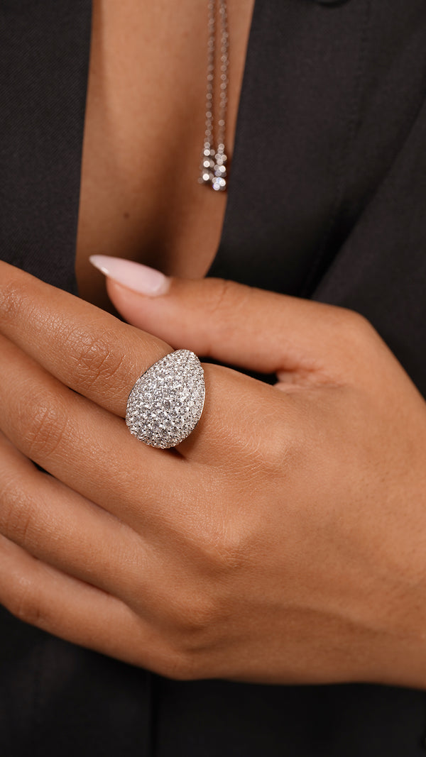 This sterling silver cocktail ring with a white gold finish features a timeless pave dome design, making it a classic statement piece for any jewellery collection