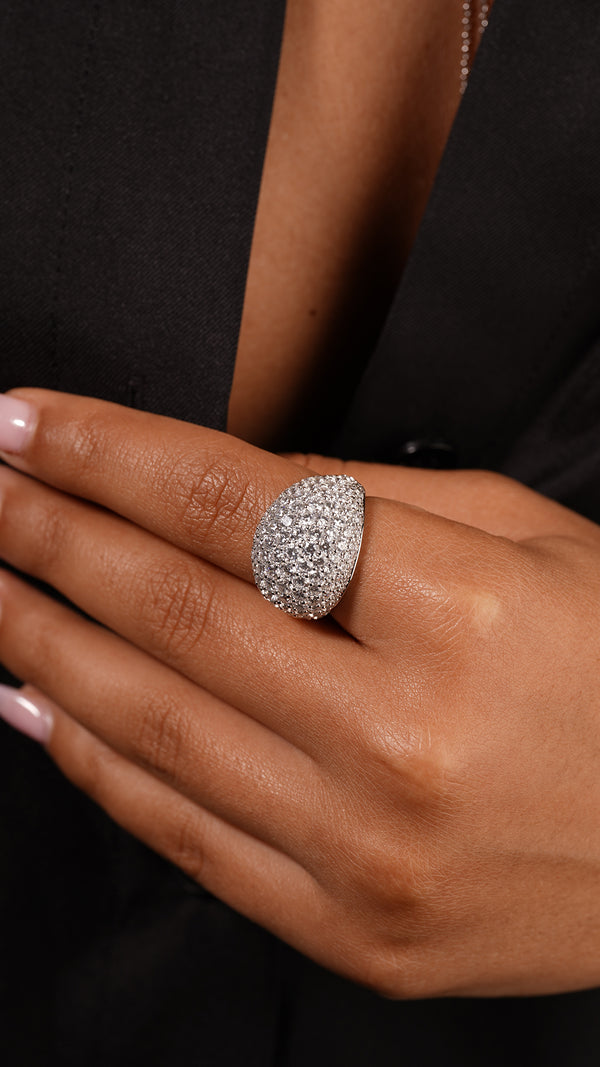 Detailed view of a timeless pave cocktail ring in sterling silver with a white gold finish, capturing the brilliance of its finely set stones.