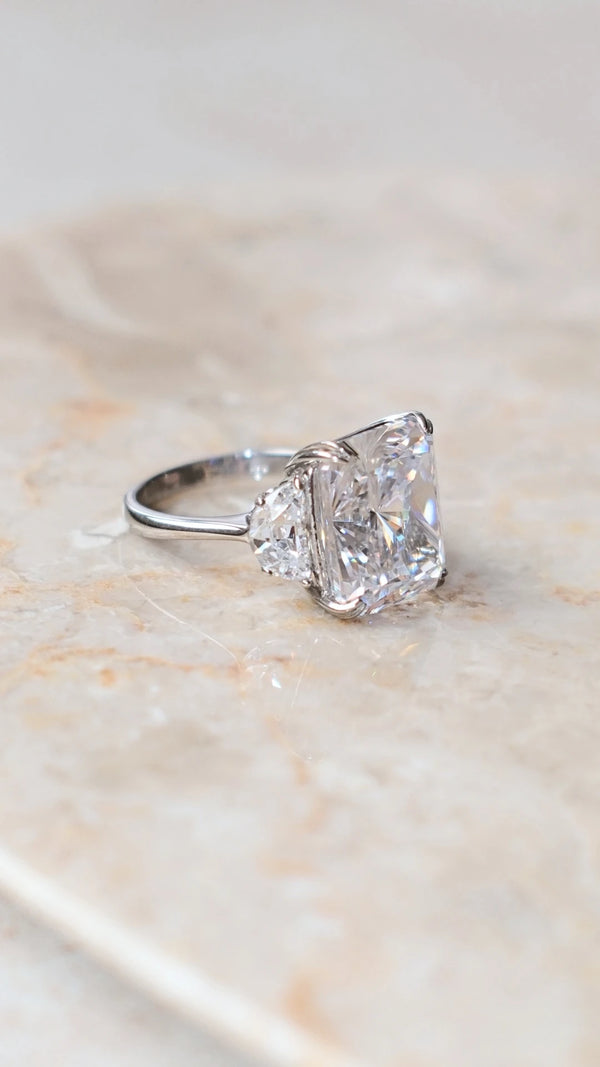 Elegant 7ct eq radiant cut ring catching the light for maximum brilliance.