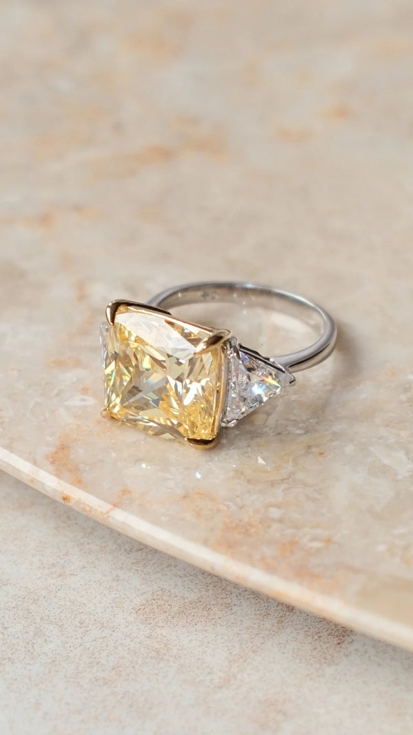 Large cushion cut yellow stone ring with a polished sterling silver band
