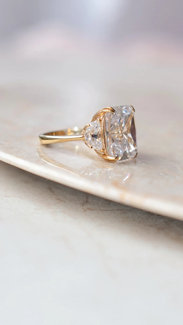 Innovative radiant cut center stone with scissors-cut style crown in gold vermeil.