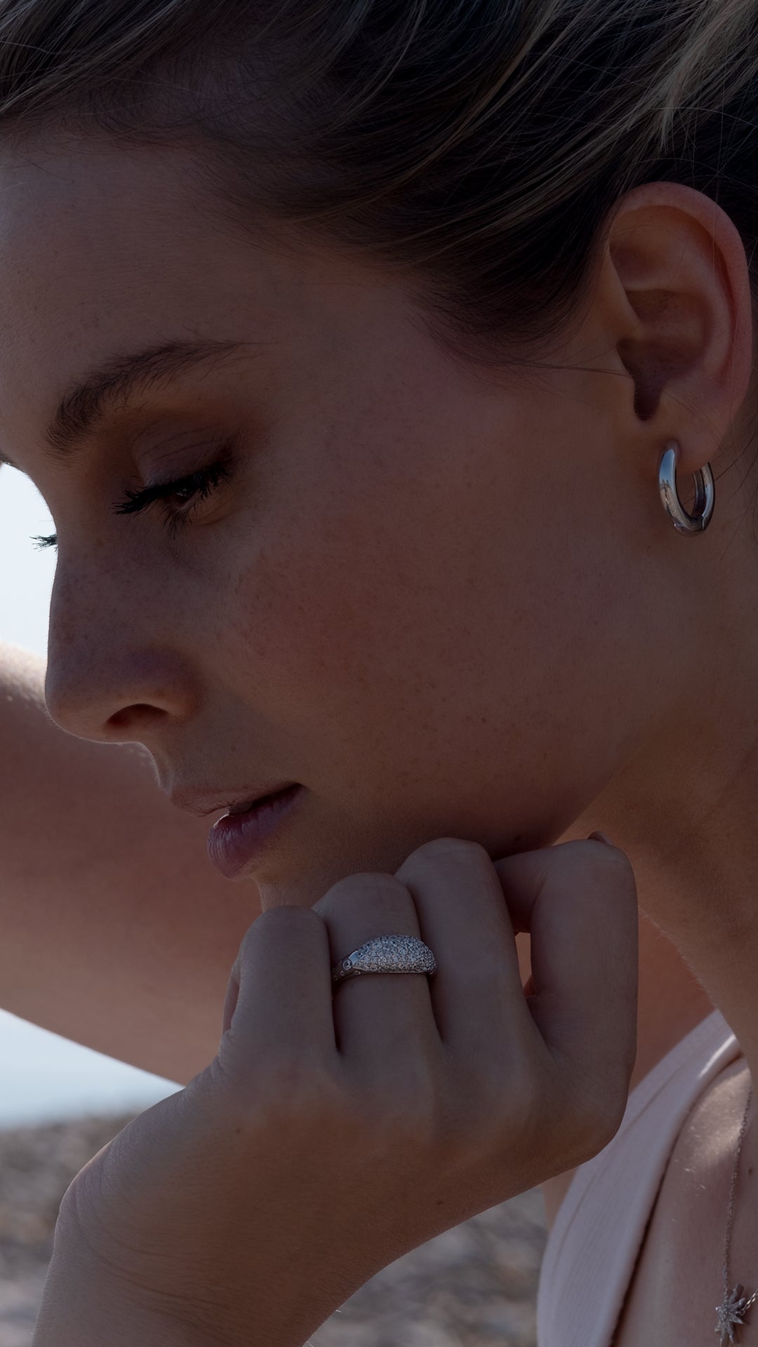 Everyday sterling silver hoops paired with sterling silver statement ring uk