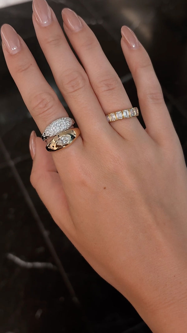 Mixed metal ring stack featuring chunky gold Sydney ring with marquise gemstone. 
