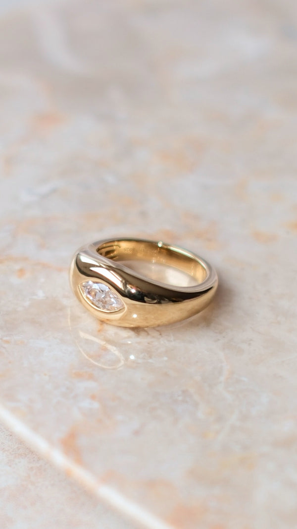 Modern take on the classic signet ring featuring a gemstone inset