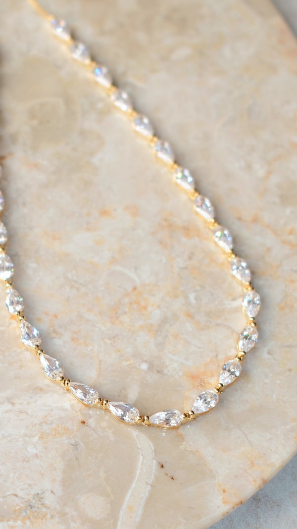 Pear shaped tennis necklace in 18k gold  vermeil with continuous prong setting and adjustable slider.