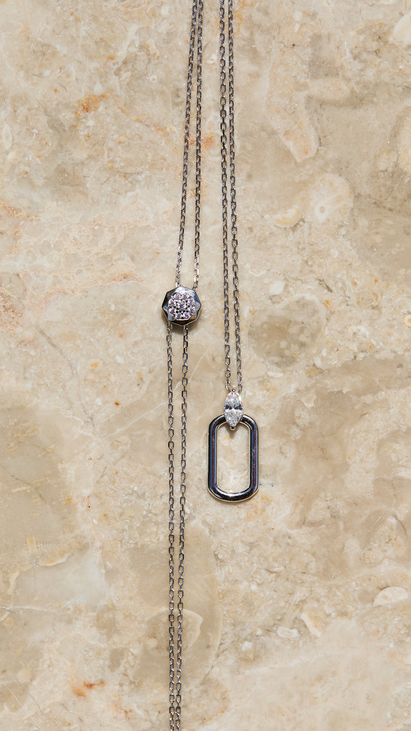 Sterling silver necklace with adjustable slider detailing.