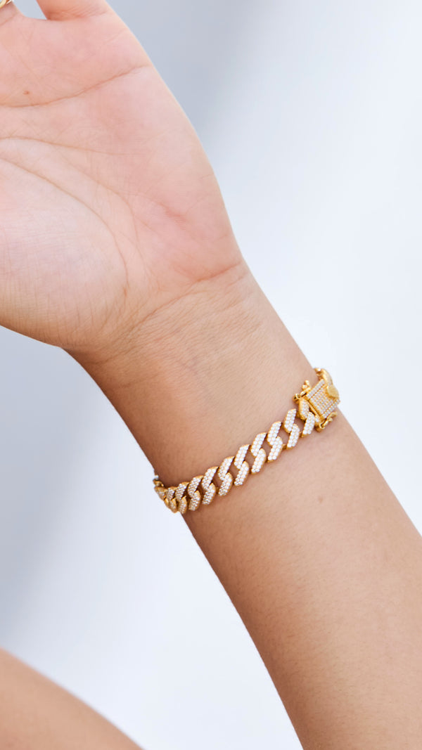 Gold cuban chunky chain bracelet for women showing clasp closure.