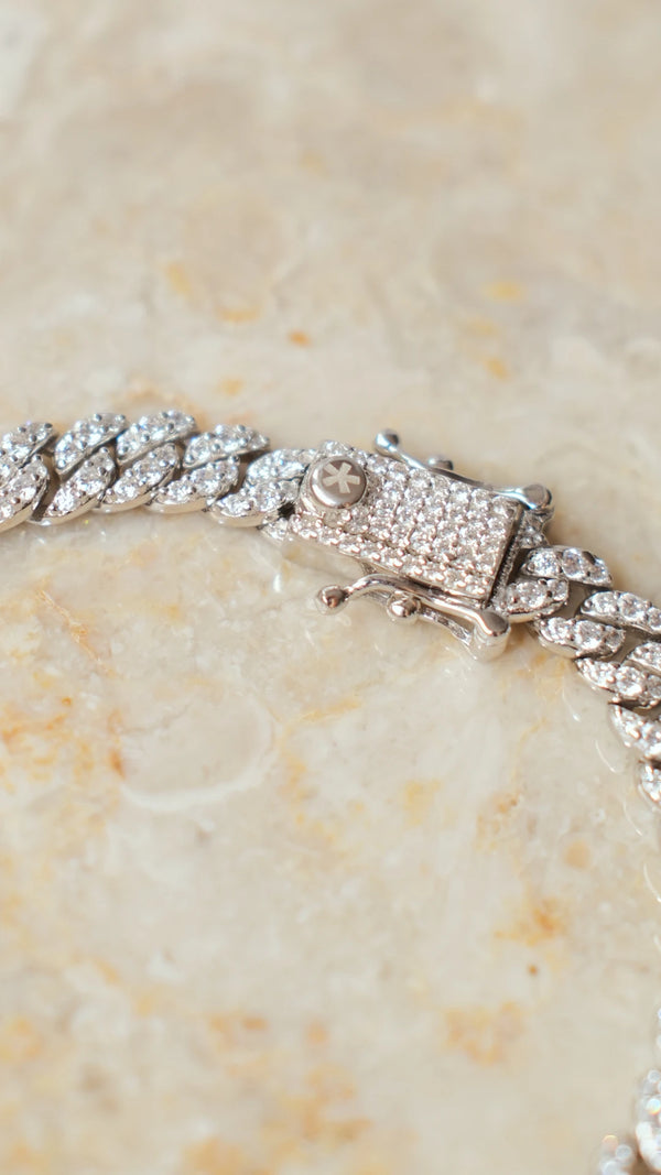 Hidden box clasp mechanism blending seamlessly into the sterling silver pavé links.
