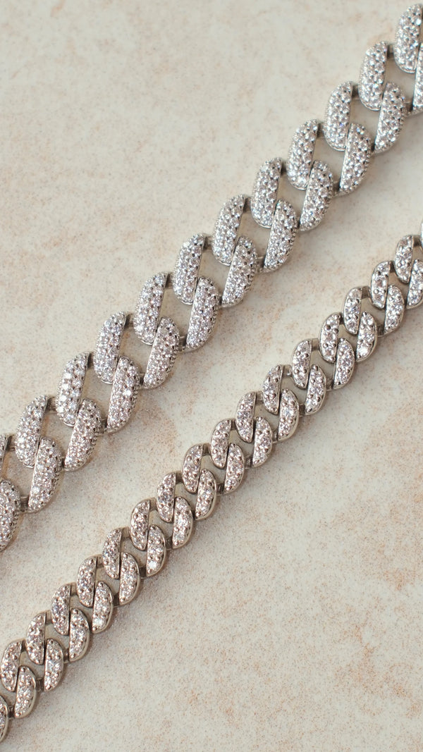 Large and small sterling silver cuban link bracelets size comparison.