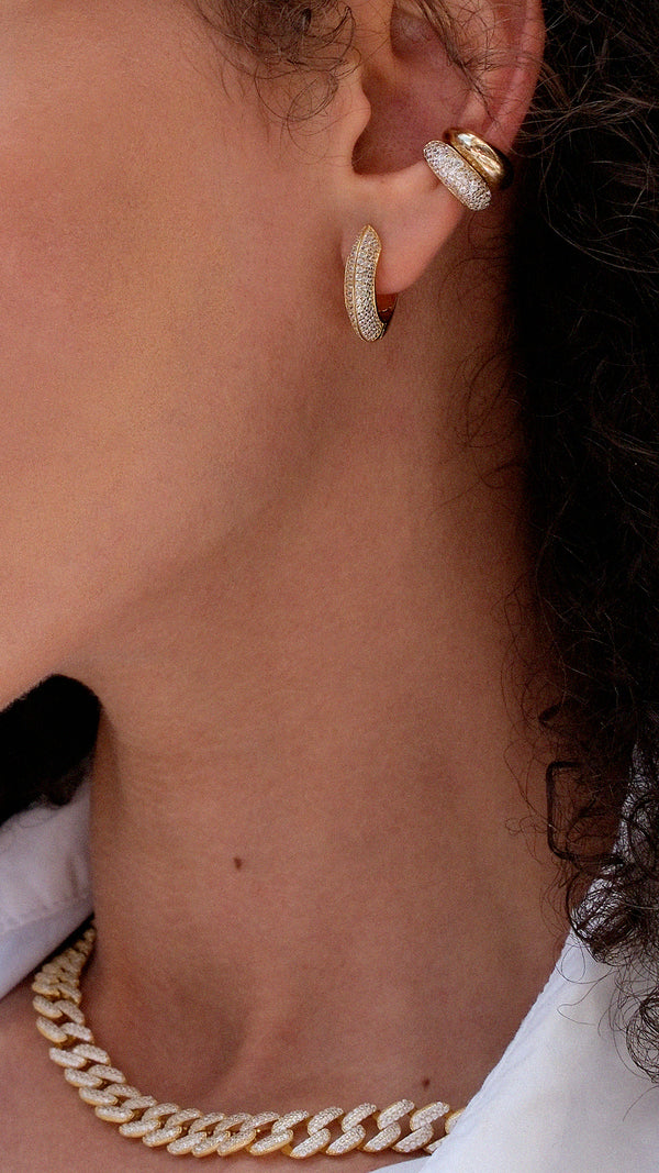 Layered gold jewellery earring look with a vermeil ear cuffs and hoops.