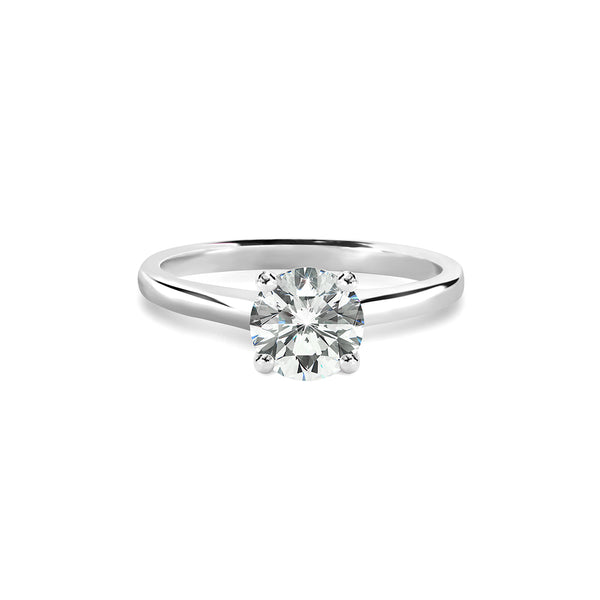 The Caroline Ring features a lab grown diamond in a classic round cut, set in polished 18K white gold—perfect for engagement rings or carat rings.

