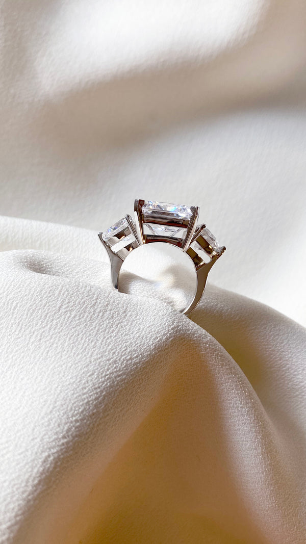Side view trilogy ring with radiant cut centre stone