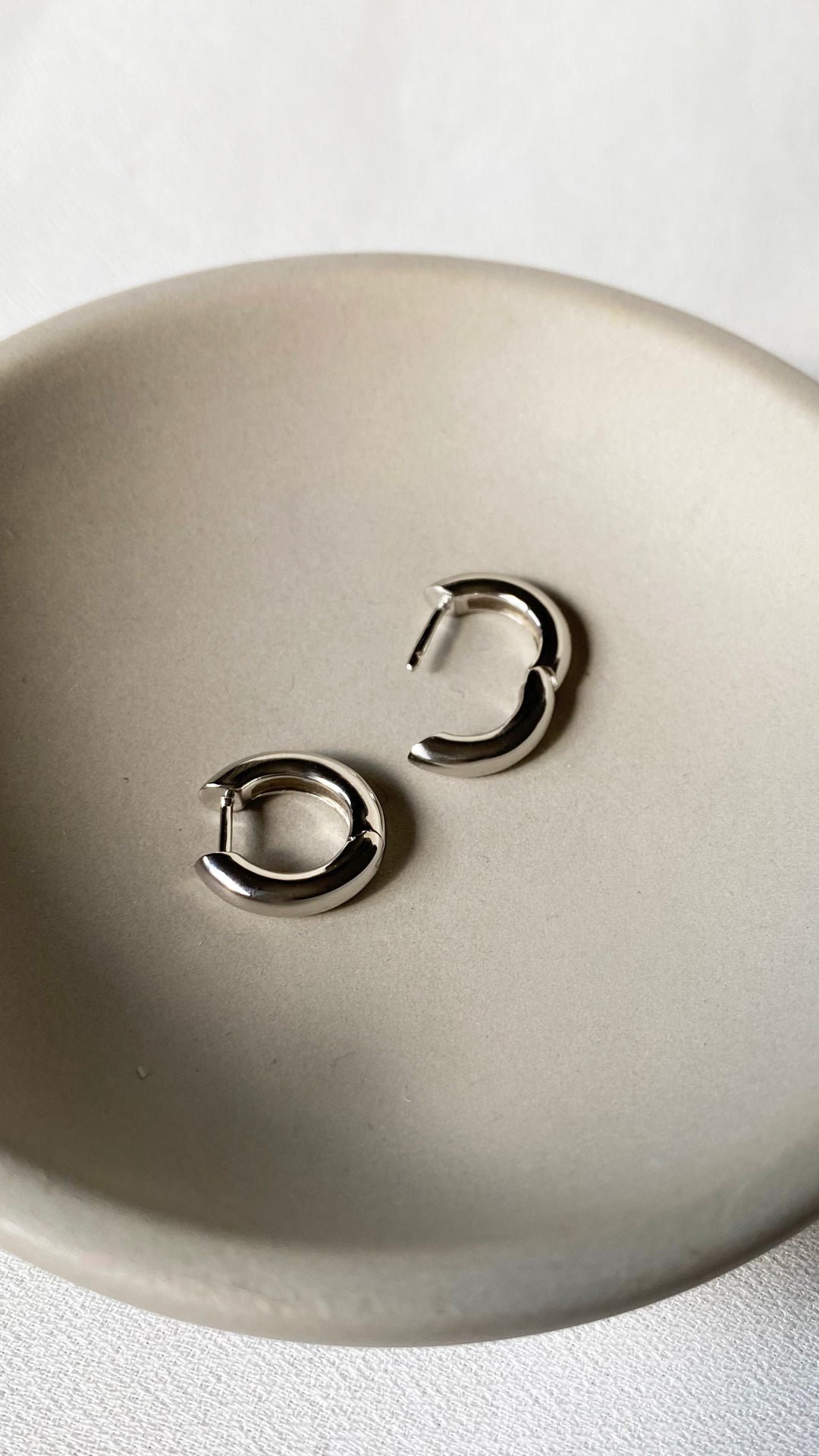 Classic high-polish sterling silver hoops, perfect for wearing solo or stacking with other earrings.